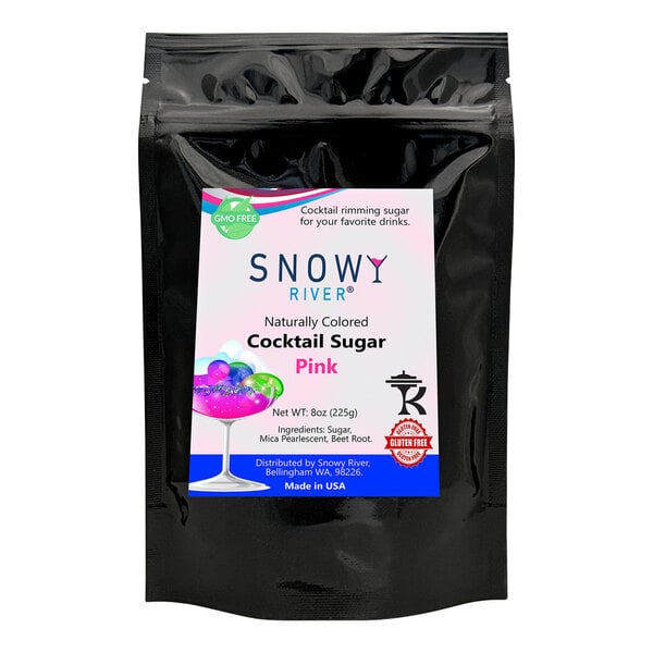 A black packet labeled "Snowy River Pink Cocktail Rimming Sugar" with pink and white snowy nugget sugar inside.