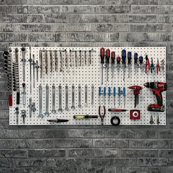 Triton Products white pegboard with tools on it including a drill and screwdriver.