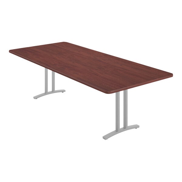 A brown rectangular Correll conference table with metal legs.