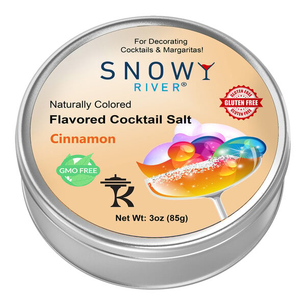 A round metal container of Snowy River Cinnamon Cocktail Rimming Salt with a label.