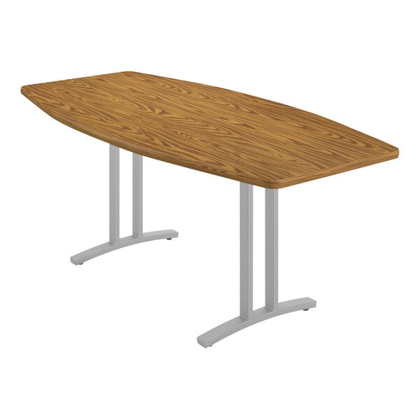 A Correll Curvature conference table with a wooden top and metal legs.