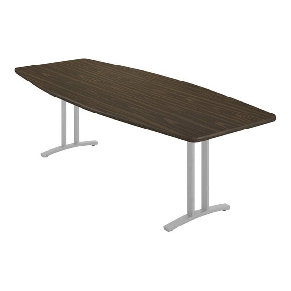 A Correll boat walnut laminate conference table with metal legs.