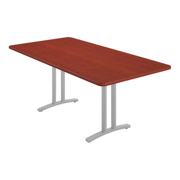 A rectangular Correll conference table with metal legs.