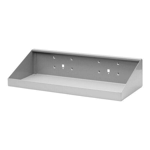 A gray metal shelf with holes.