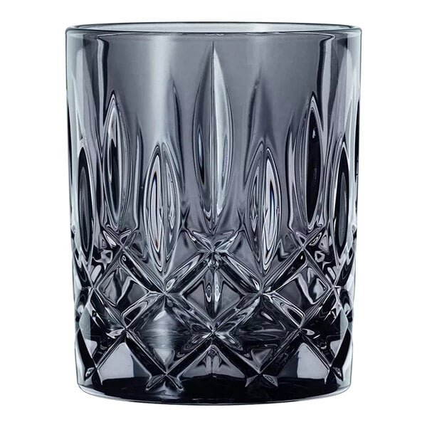 A close up of a Nachtmann Noblesse smoke rocks glass with a pattern.