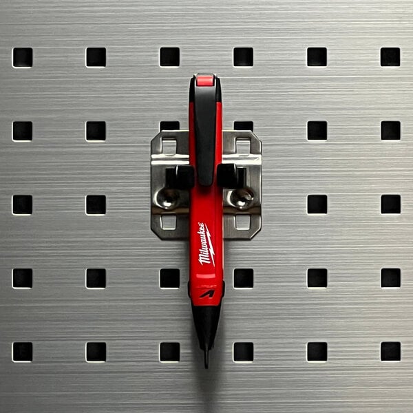A red and black Triton Products LocHook extended spring clip on a metal surface.