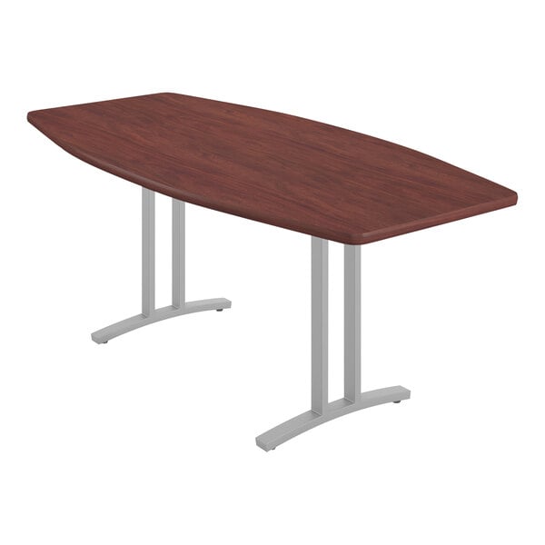 A Correll deluxe high-pressure laminate conference table with a boat-shaped top and metal legs.