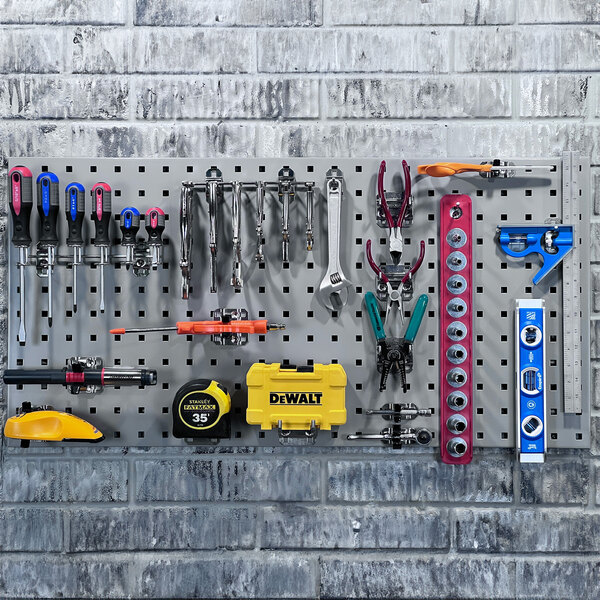 A gray metal Triton LocBoard with tools on it.