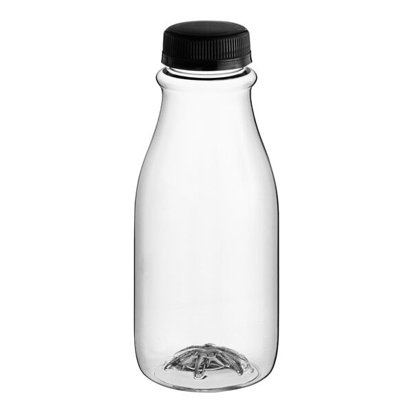 A close-up of a 12 oz. clear PET round carafe juice bottle with a black lid.