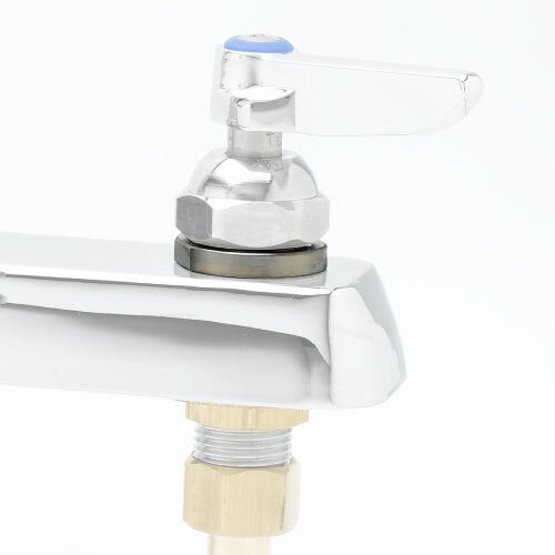 A close-up of a chrome T&S faucet escutcheon with a blue and white object.