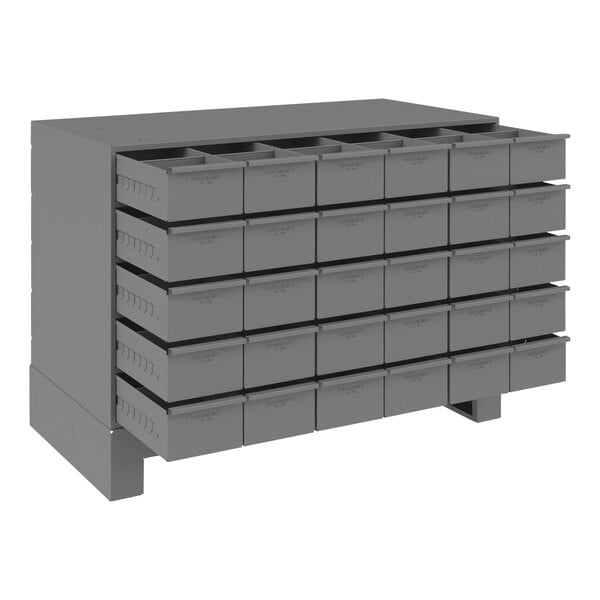 A grey metal drawer with many compartments.