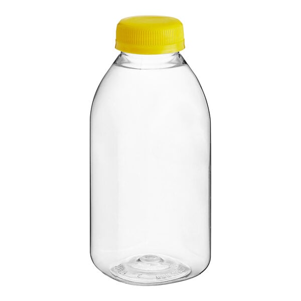 A clear plastic 12 oz. Square Milkman juice bottle with a yellow lid.