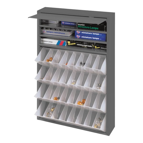 A grey Durham steel tilt-out cabinet with many small white bins.