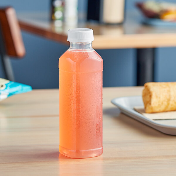 A close-up of a Square PET clear juice bottle filled with pink liquid with a white lid.