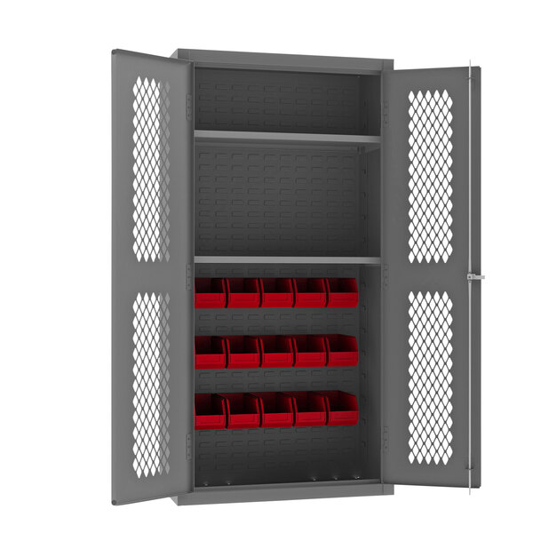 A grey metal Durham storage cabinet with red bins.
