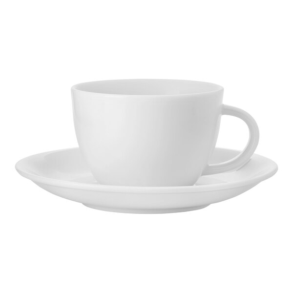 A Luzerne bright white porcelain espresso cup and saucer on a saucer.