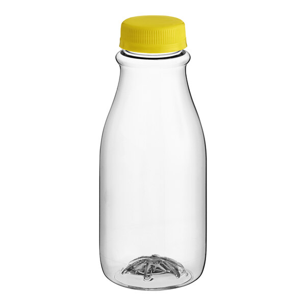 A close-up of a 12 oz. clear plastic carafe juice bottle with a yellow plastic cap.