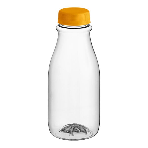 A close-up of a clear plastic carafe juice bottle with a yellow lid.