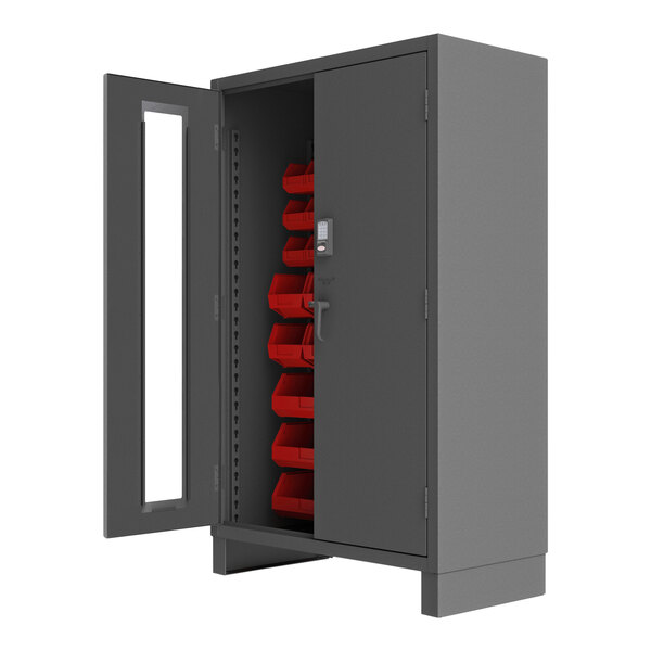 A grey metal Durham storage cabinet with red bins.