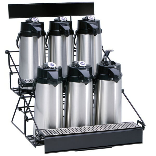 A black Curtis wire rack holding six silver coffee airpots.