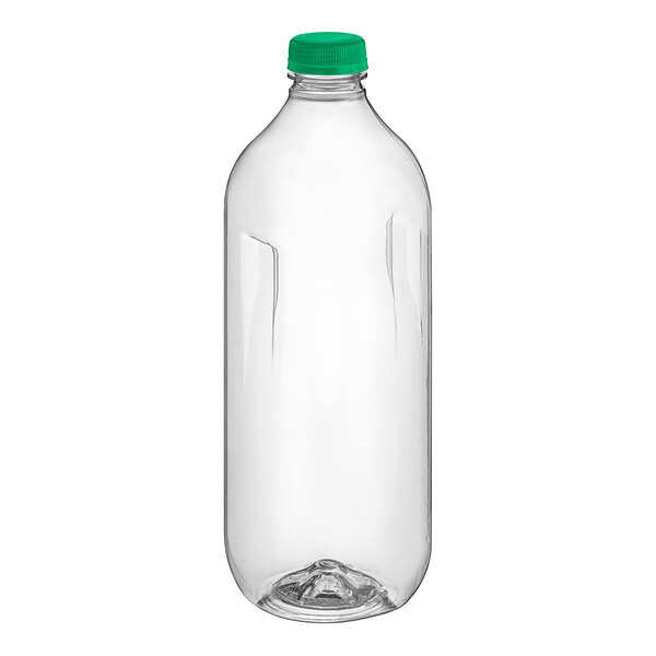 A clear plastic square juice bottle with a green cap.