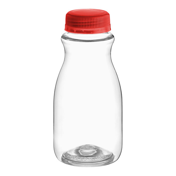 A close-up of a clear PET juice bottle with a red cap.
