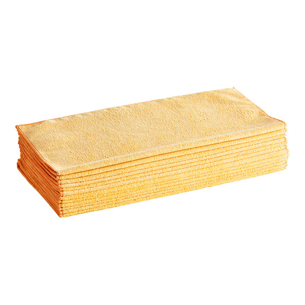 A stack of orange Lavex microfiber cloths.