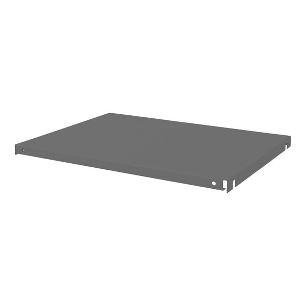 A grey metal Durham shelf with holes on a white background.