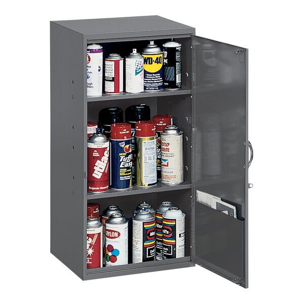 A gray Durham steel storage cabinet with three shelves holding cans of spray paint.