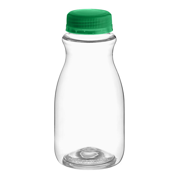 A clear plastic Round PET carafe juice bottle with a green cap.