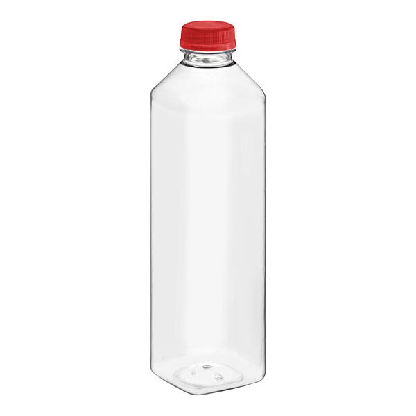 A clear plastic tall square juice bottle with a red cap.