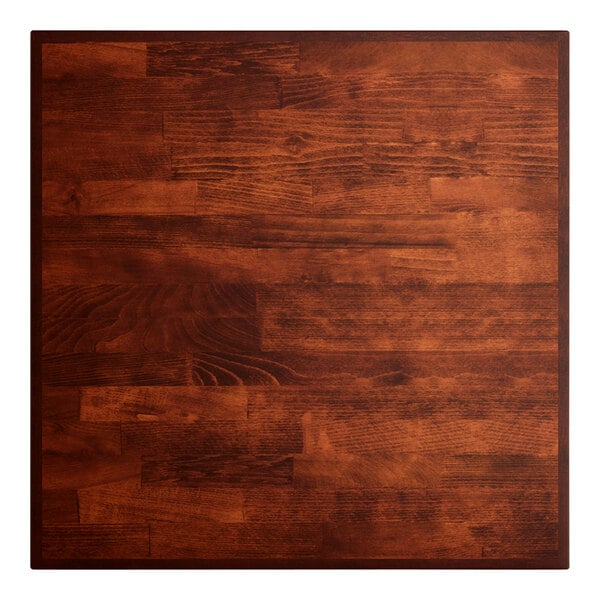 A close-up of a wood surface with a square pattern.