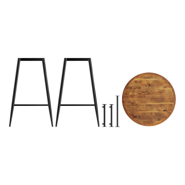 A Lancaster Table & Seating round butcher block table with metal legs.