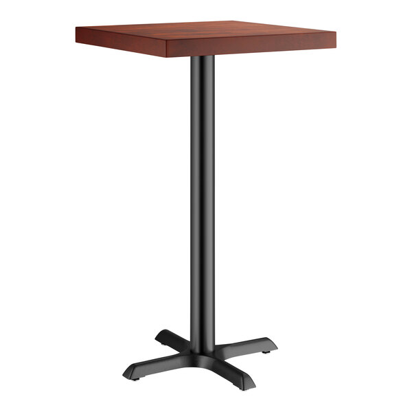 A Lancaster Table & Seating square table with a mahogany top and black base plate.
