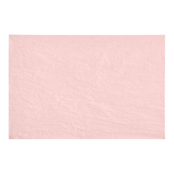 A white background with pink tissue paper sheets wrapped in a clear plastic bag.
