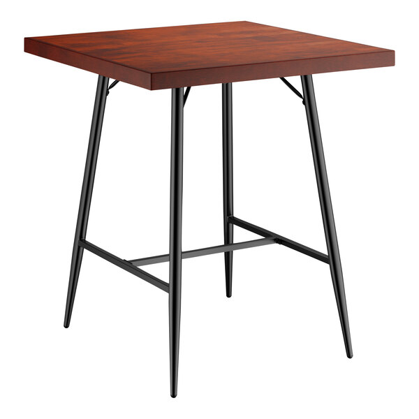 A Lancaster Table & Seating square butcher block table with mahogany finish and black metal legs.