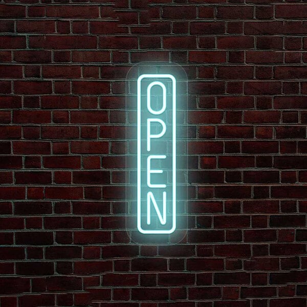 An ice blue LED vertical "Open" sign on a brick wall.