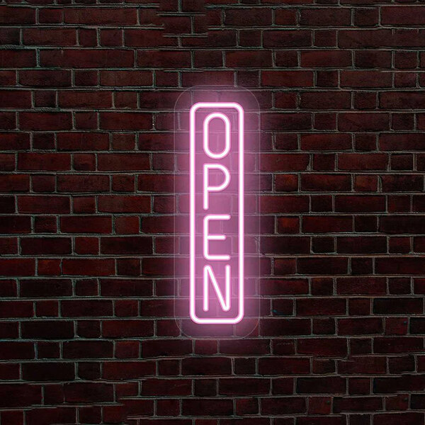 A pink LED "Open" sign on a brick wall.