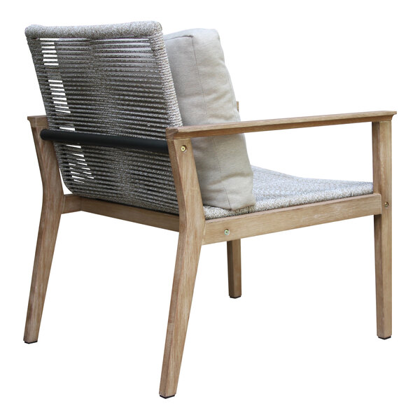 An Outdoor Interiors eucalyptus and rope lounge chair with a white cushion.