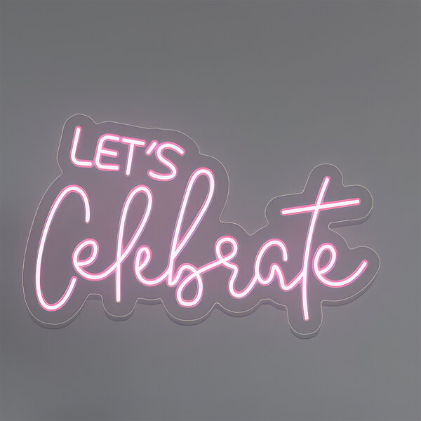 A pink neon sign that says "Let's Celebrate" in white text.
