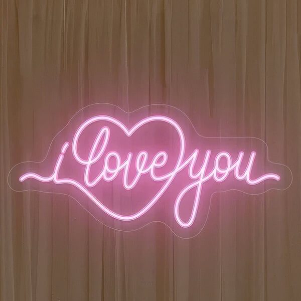 A pink Crazy Neon "I Love You" LED sign with a heart.
