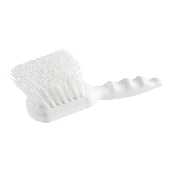 A close-up of a Lavex white utility scrub brush with white bristles.