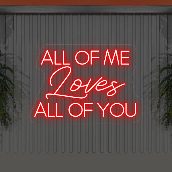 A Crazy Neon red LED sign that says "All Of Me Loves All Of You" on a wall.