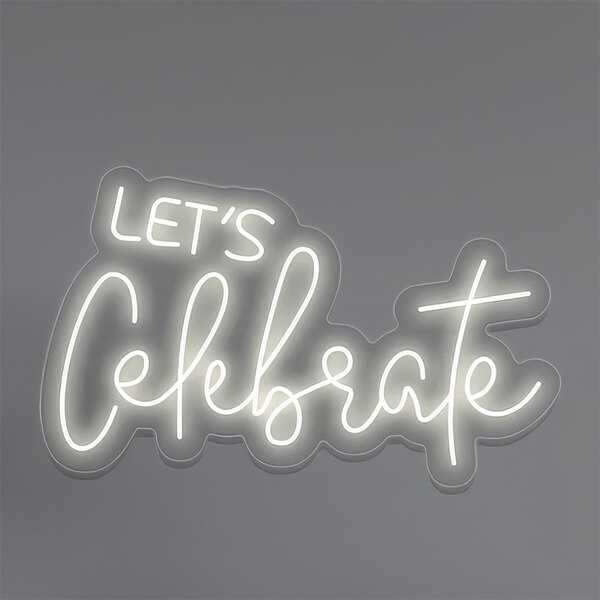 A close up of a white lit up neon sign that says "Let's Celebrate" in white text.