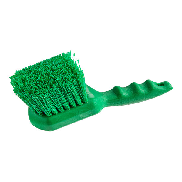 A close-up of a Lavex green polyester floating utility/pot scrub brush with a handle.