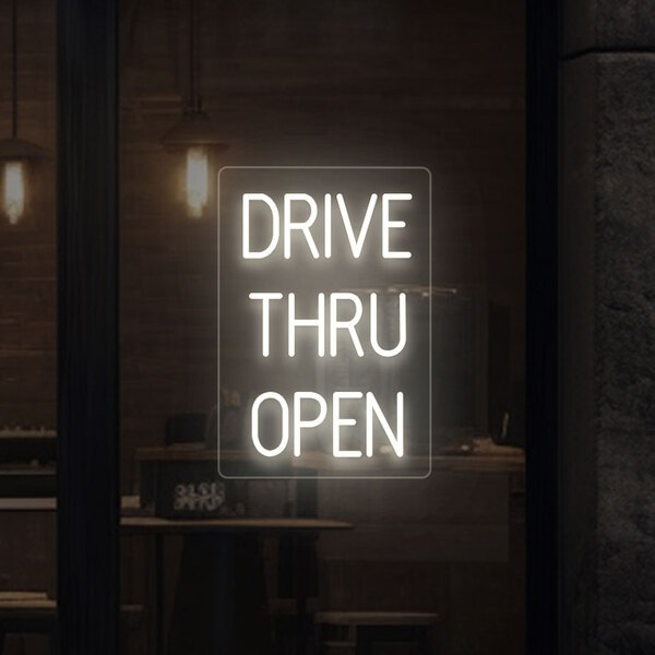 A Crazy Neon warm white LED "Drive Thru Open" sign with white lit up letters on a black border.