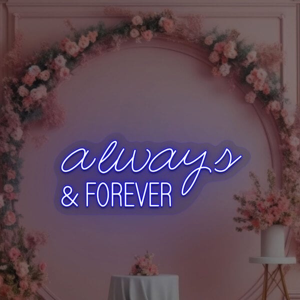 A blue neon sign that says "Always & Forever" on a pink wall with flowers.