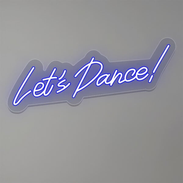 A blue neon sign that says "Let's Dance!" in white text.