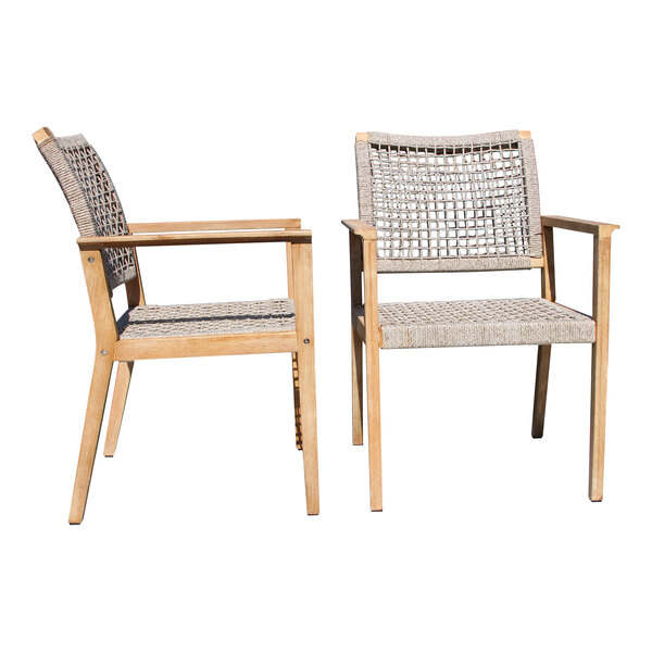 Two Outdoor Interiors stackable chairs with woven seats and backrests on a white background.