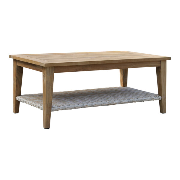 An Outdoor Interiors teak and ash wicker coffee table with a wicker shelf.